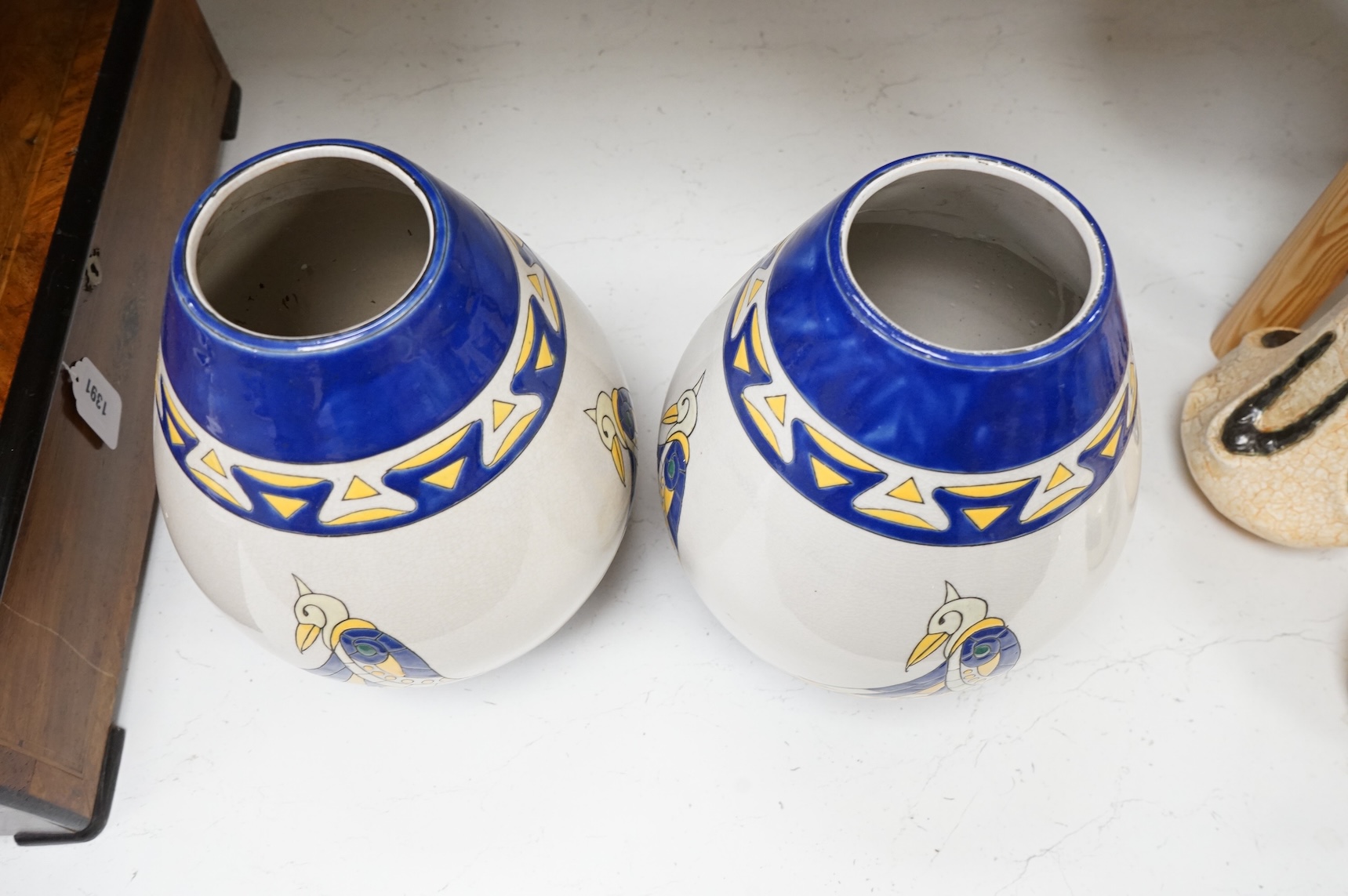 A pair of contemporary Boch Keramis pottery stylised Egyptian bird vases